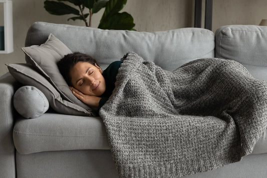 person napping on couch